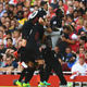 Liverpool celebrate one of their many goals against Arsenal. (Photo credit: Mike Hewitt/Getty)